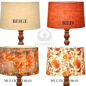 May include: A collection of lamps with various shades, including jute, beige, red, black, yellow, and floral patterns. Each lamp has a wooden base and a fabric shade. The shades are labeled with their respective colors or patterns.