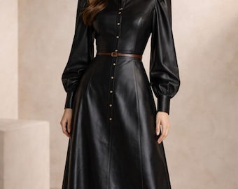 Vestido midi de cuero negro, estilo vintage con botones delanteros, cinturón y manga larga.