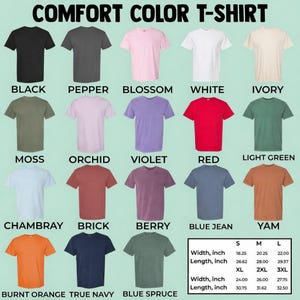 May include: A selection of Comfort Color T-shirts in a variety of colours, such as black, white, and red. The image displays a range of sizes and colours, with a size chart showing width and length in inches. The text "COMFORT COLOR T-SHIRT" is at the top.