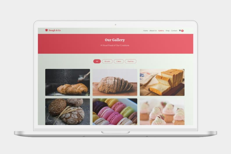 K&ouml;nnte beinhalten: Ein Laptop-Bildschirm, der eine Website-Galerie mit Bildern von Backwaren anzeigt. Der Website-Header ist rot mit dem Text "Tough & Co" und "Our Gallery". Zu den Bildern geh&ouml;ren Croissants, geschnittenes Brot und Macarons.