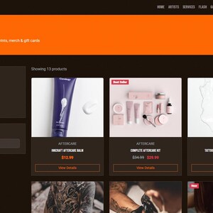 May include: A website shop page displaying tattoo aftercare products. The page has a dark brown background with an orange header. Products include aftercare balm, a complete aftercare kit, and a sunscreen stick.