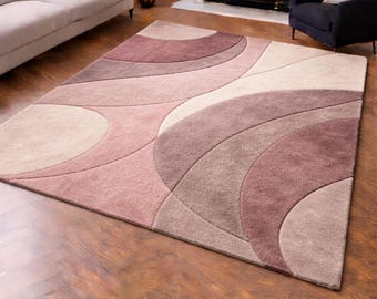 Alfombra abstracta en beige y rosa ruborizado, moderna alfombra ondulada y curva para sala de estar.
