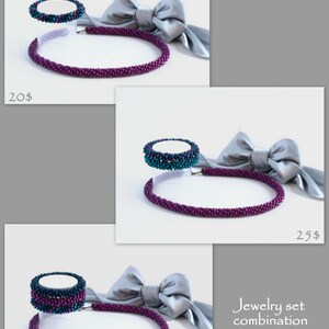 May include: Three sets of jewelry featuring a purple beaded necklace and a teal and purple beaded bracelet. The jewelry is displayed on a white surface with a gray satin ribbon tied in a bow.