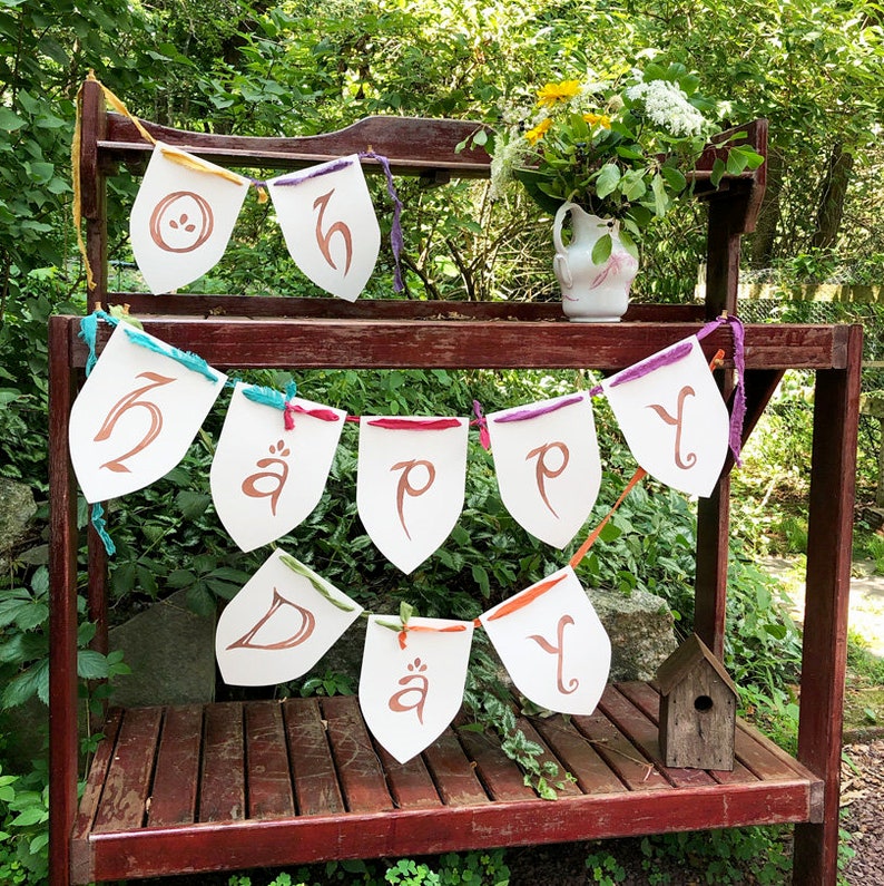 Oh Happy Day banner in lettering inspired by maps created by JRR Tolkien. Handmade by Talufane