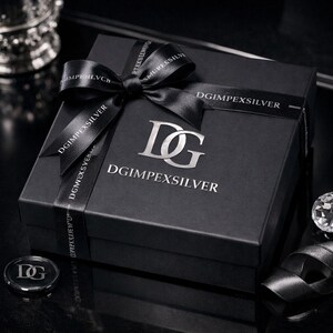 May include: A black gift box with a silver logo and the text "DGIMPEXSILVER" on the box and ribbon. The box is tied with a black ribbon and bow. A small silver coin with the logo is also visible.