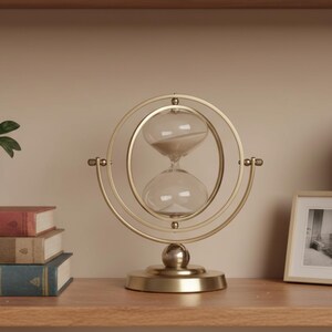 Versatile Desk Accessory Rotating Sand Timer Functional Office Decor Meditation Time Keeper Elegant Metal Frame Construction Decorative Glass Hourglass Display Swivel Design Feature Beautiful Sand Flow Movement Professional Workspace