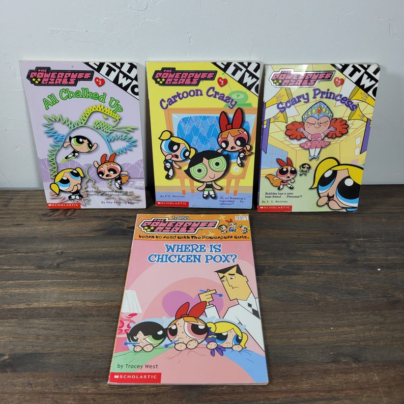 May include: A set of five paperback books featuring the Powerpuff Girls. The books are titled "All Chalked Up", "Cartoon Crazy", "Scary Princess", and "Where is Chicken Pox?" The books are all in the same style, with a colorful cover featuring the Powerpuff Girls.