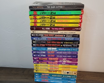 May include: A stack of 20 paperback books by R.L. Stine, featuring the Fear Street and Goosebumps series. The books have colorful covers with various titles, including "The Baby-sitter II", "The Last Scream", "The Betrayal", and "Goodnight Kiss 2".