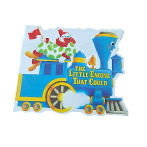 Könnte beinhalten: Ein Set aus drei Keramikbechern mit gesprenkelter, matter Oberfläche. Die Becher sind in den Farbtönen Creme, Hellgrau und Dunkelgrau gehalten. Jeder Becher hat ein schlichtes, minimalistisches Design und einen abgerundeten Henkel.