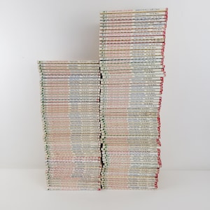May include: A stack of over 70 paperback books with red and white covers. The books are all titled "Baby-Sitters Little Sister" and feature the name "Karen's" followed by a different title for each book. The books are all by Ann M. Martin.