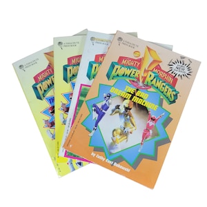 May include: Four vintage Mighty Morphin Power Rangers books. The books have colorful covers with the Power Rangers logo and illustrations of the characters. The book titles include "The Bad Dream Machine" and "The Th".