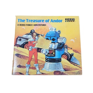 May include: A book cover featuring a blue robot and a person holding a map. The book title is "The Treasure of Andor" and the subtitle is "A Robo Force Adventure".