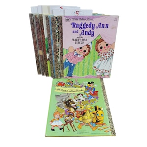 May include: A stack of vintage Little Golden Books, including "Raggedy Ann and Andy and the Rainy Day Circus".