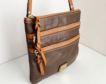 Dooney & Bourke North South Triple Zip Crossbody in chocolate dark brown smooth leather and tan trim