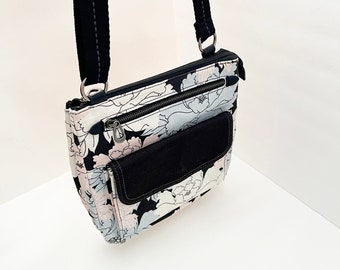 Sakroots City Swing Pack messenger crossbody bag black blush pink pale blue pastel floral shoulder bag