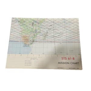 May include: A vintage STS 61-B Mission Chart, Edition 1, from September 1985. The chart features a map of Africa and surrounding areas, with grid lines and data. The title is in bold, black text.