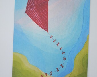 May include: A red kite with a long tail of red bows flies in a blue sky with green and white clouds.