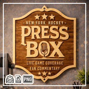 May include: Wooden sign with the text "- NEW YORK HOCKEY - PRESS BOX" and "LIVE GAME COVERAGE FAN COMMENTARY". The sign features a microphone graphic and star accents. The sign is brown with a lighter wood border.