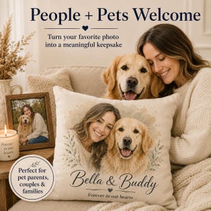May include: A square throw pillow featuring a printed illustration of a person and a golden retriever. The text reads Bella & Buddy and Forever in our hearts. The design includes watercolor-style foliage accents on a light beige fabric background.