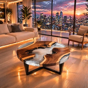 May include: A round coffee table with a unique design. The table features a wooden top with a natural edge, filled with a light gray resin. The table has a black metal base. The table is in a living room with a city view.