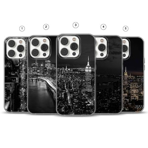May include: A collection of five phone cases featuring black and white images of New York City. Each case showcases a different cityscape view, including aerial perspectives and iconic landmarks like the Empire State Building.