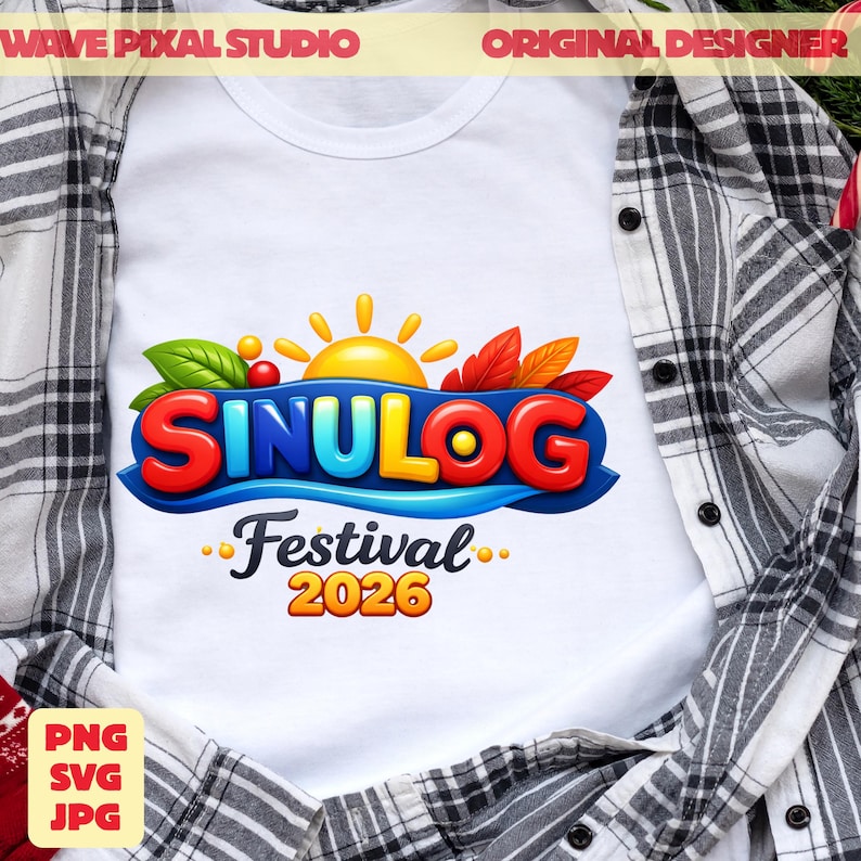 May include: White t-shirt featuring the text "SINULOG Festival 2026" in vibrant colors. The design includes a sun, leaves, and a blue wave element. The shirt is displayed on a plaid shirt.