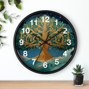 May include: A round wall clock with a black frame. The clock face features a gold and green tree design against a blue background. White numbers mark the hours. The clock hands are black.