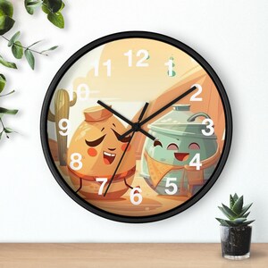 May include: A round wall clock with a black frame. The clock face features a desert scene with two cartoon characters. One is orange and the other is teal. The clock hands point to 10:08.