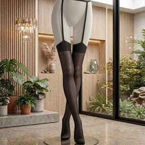 May include: Sheer black thigh-high stockings with an integrated garter belt design. The hosiery features opaque black bands at the top of the thighs, connected by vertical straps to a thin black waistband, worn on a white mannequin base.