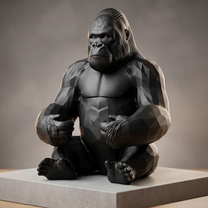 May include: A black gorilla sculpture with a geometric design, seated on a gray rectangular base. The gorilla is holding its hands together, with detailed facial features. A pen and a notebook are in the foreground.