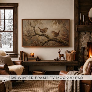 May include: A digital television screen displaying a painting of two small brown birds perched on a mossy tree branch. The artwork features muted earth tones and is enclosed in a rectangular wooden frame, presented as a 16:9 winter frame TV mockup.