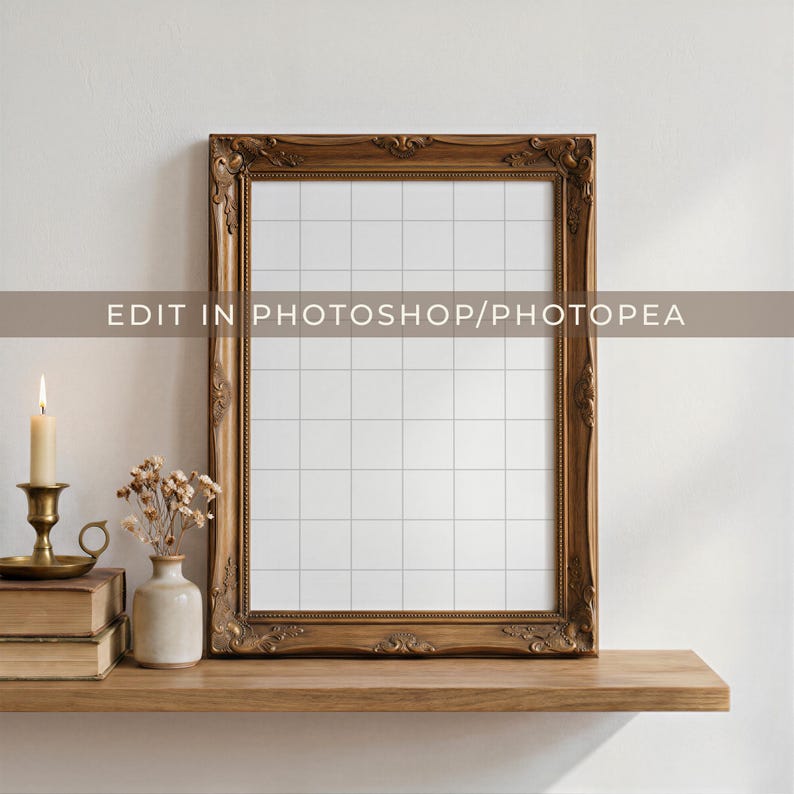 Antique carved wood frame mockup shown with a transparent grid overlay inside the frame opening, styled atop a wooden shelf with candle and book decor for a cozy, neutral-toned scene. Overlay text reads "Edit in Photoshop/Photopea."
