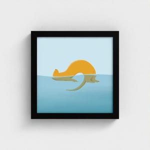 May include: A framed art print featuring a minimalist illustration of an orange otter swimming in blue water. The otter's body is partially submerged, with its reflection visible. The artwork is set against a light blue background.