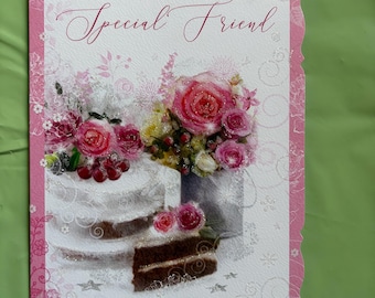 May include: A birthday greeting card with a pink border and the words "Birthday Wishes Special Friend." The card features a cake with pink roses and a slice of chocolate cake. The background is white with floral accents.