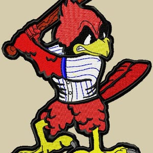 May include: Embroidered patch featuring a red cardinal bird in a baseball uniform, holding a wooden bat. The bird has a yellow beak and feet, with a black outline. The uniform is white with blue stripes and buttons.