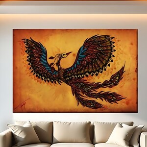 May include: A large, rectangular canvas art piece depicting a phoenix in flight. The artwork features a warm color palette with shades of orange, red, and brown. The phoenix has detailed feather patterns in blue, brown, and red. The artwork is displayed above a beige sofa.