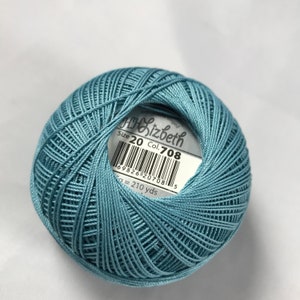 May include: A ball of blue embroidery floss with a label that reads "Lizbeth Size 20 Col. 708 6982612070815 5g = 210 yds"