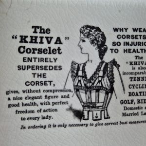 May include: A vintage illustration promoting the "KHIVA" Corselet, a supposed alternative to corsets. The image features a woman's profile and a drawing of the corselet, with text highlighting its benefits and activities it's suitable for.