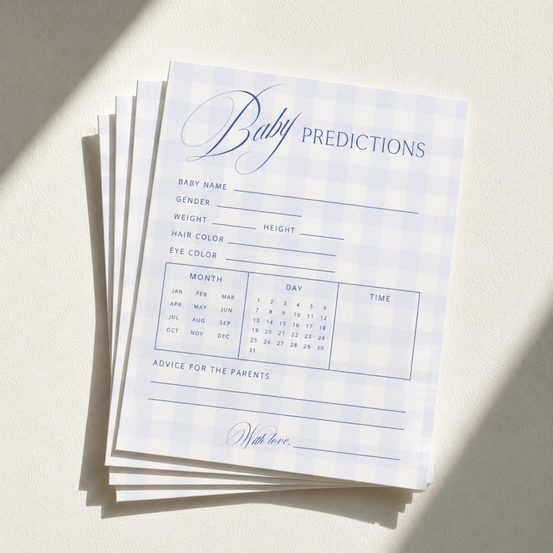 May include: A stack of rectangular paper cards featuring a light blue and white gingham pattern. The text reads Baby PREDICTIONS with fields for name, gender, weight, height, hair color, eye color, a calendar grid for date and time, and advice.
