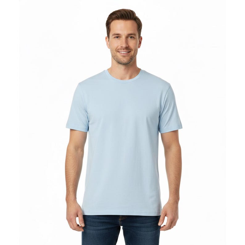 May include: A set of three ceramic mugs with a speckled, matte finish. The mugs are in shades of cream, light brown, and dark brown. Each mug has a simple, minimalist design and a rounded handle.