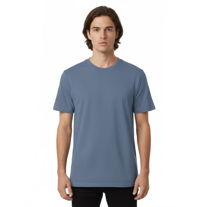 May include: A set of three ceramic mugs with a speckled, matte finish. The mugs are in shades of cream, light gray, and dark gray. Each mug has a simple, minimalist design and a rounded handle.