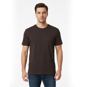 May include: A solid brown crew neck t-shirt. The short-sleeved shirt is made of a soft material. The model is wearing blue jeans. The shirt is a basic wardrobe staple.