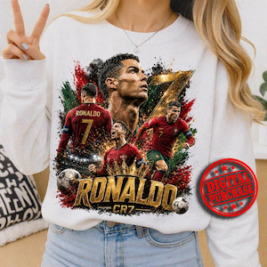 White t-shirt mockup displaying a dramatic Ronaldo CR7 streetwear football graphic with layered action poses, a large portrait, gold number 7, crown accent, soccer balls, red and green paint splatter, black smoke effects, stadium-style glow, and bold gold “RONALDO” typography. Includes a red Digital Purchase stamp for a printable digital design.
