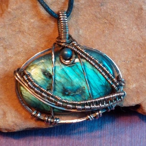 LABRADORITE, Bright Blue, 196, Hematite Bead, Pendant Wire wrapped with Copper on adjustable black cord necklace. MODEL. BPJ196 image 1