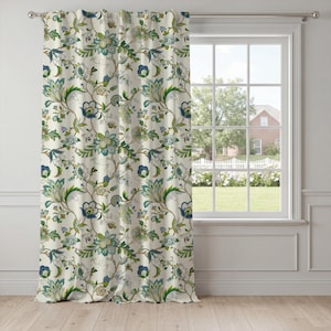May include: A floor-length curtain panel featuring an off-white background with a repeating botanical pattern of stylized flowers and leaves in shades of deep blue, teal, sage green, and light brown, suspended from a silver metal curtain rod.