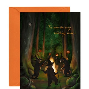 Three dancing bears surround a bonfire. They are dressed as witches. The surrounding forest is dark and the fire is bright, lighting the bears faces in orange and yellow. This card is shown with an orange envelope.