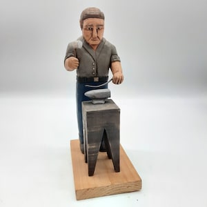 Vintage hand carved wooden painted folk art blacksmith with anvil figurine