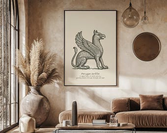 May include: A framed print featuring a detailed black and white illustration of a Phrygian Griffin. The artwork is displayed on a cream-colored background with text below. The print is in a black frame, displayed in a living room setting.