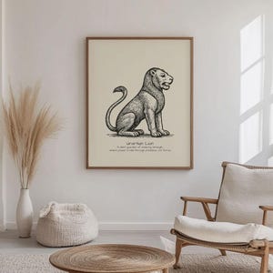 May include: A framed print featuring a detailed black and white illustration of a lion in a seated position. The artwork includes text at the bottom that reads "Urartian Lion". The print is displayed in a light-colored room with neutral decor.