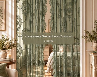 May include: A pair of sage green sheer lace curtains featuring an intricate floral pattern and ruffled edges. The curtains are hung within an arched doorway, with the text Cassandre Sheer Lace Curtain Green displayed in the center of the image.